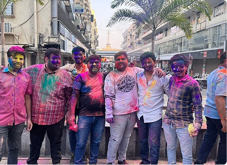 Team celebrating Holi festival
